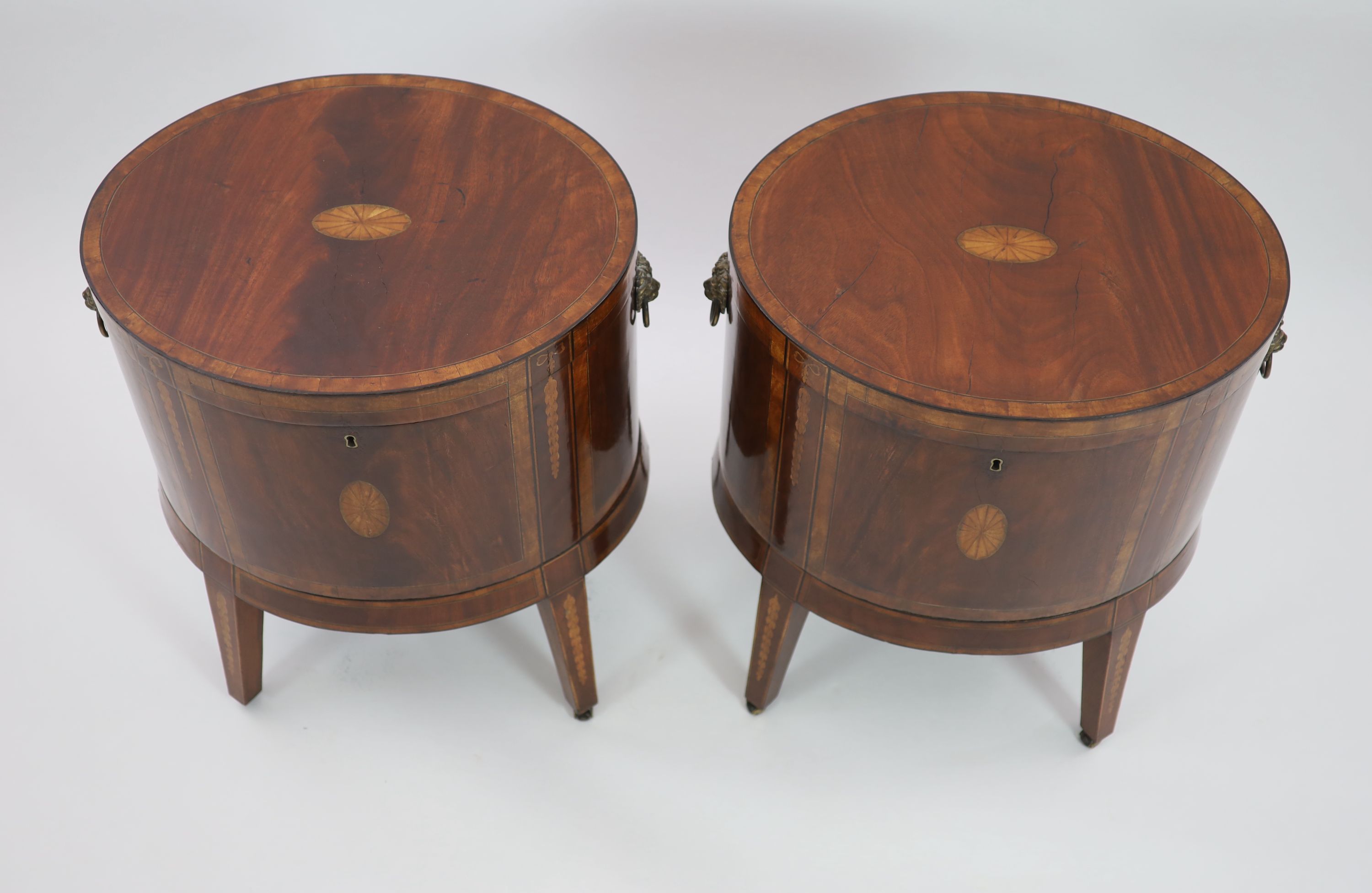 A pair of George III Sheraton style oval inlaid mahogany cellarets, W.64cm D.46cm H.68cm